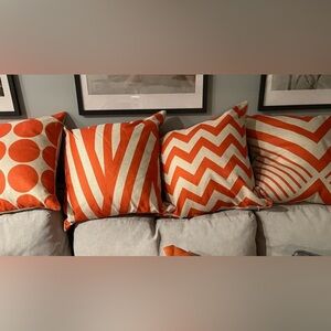 Set of 4 orange patterned pillow cases. Used with my wicker furniture.